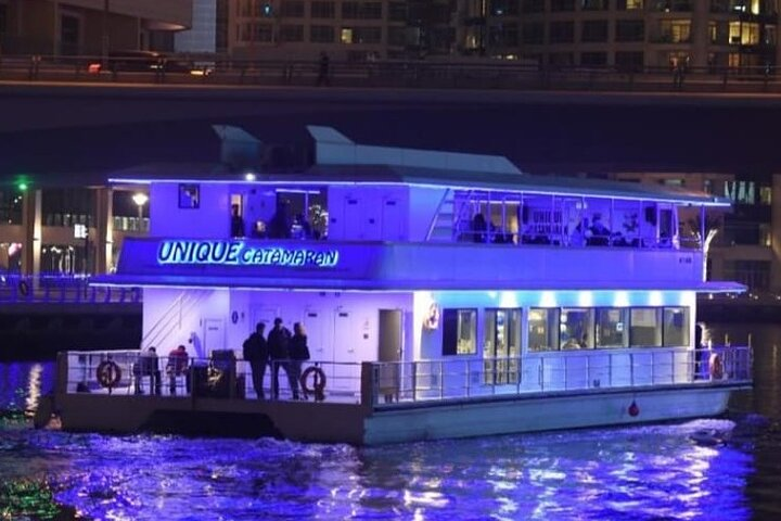 Savor a delightful dinner cruise on a historic Dhow surrounded by Dubai's stunning skyline and iconic landmarks while enjoying live music and traditional dance performances.